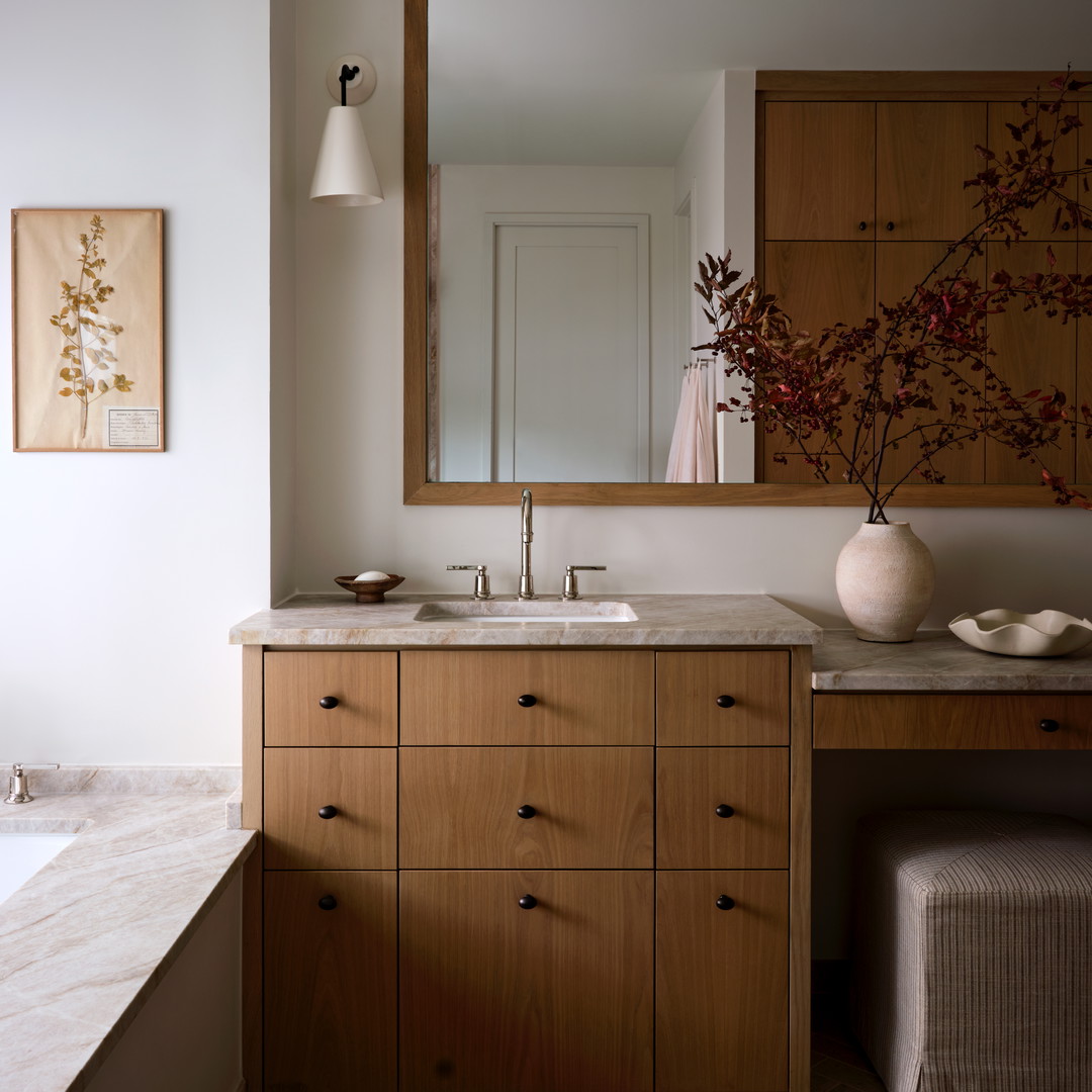 a bathroom with a large mirror and a sink