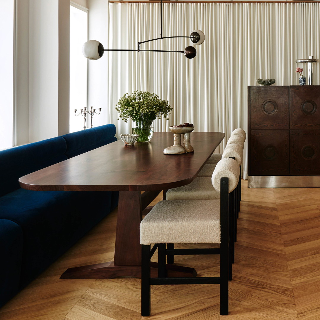 a dining room with a table and chairs