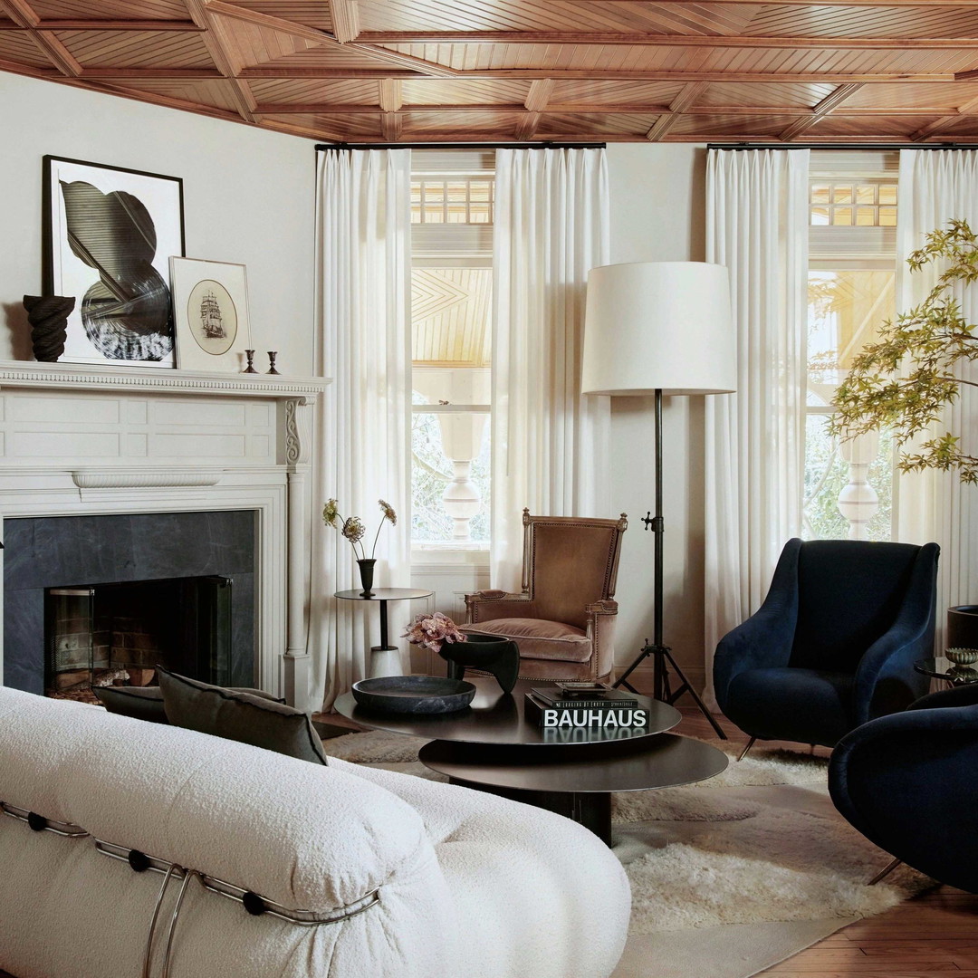 a living room filled with furniture and a fire place