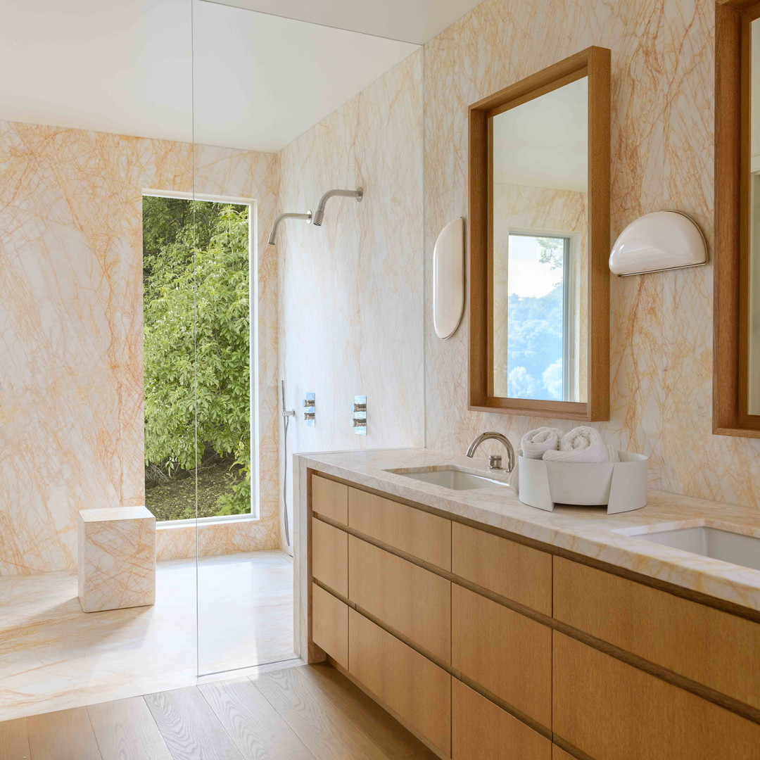 a bathroom with two sinks and a large mirror