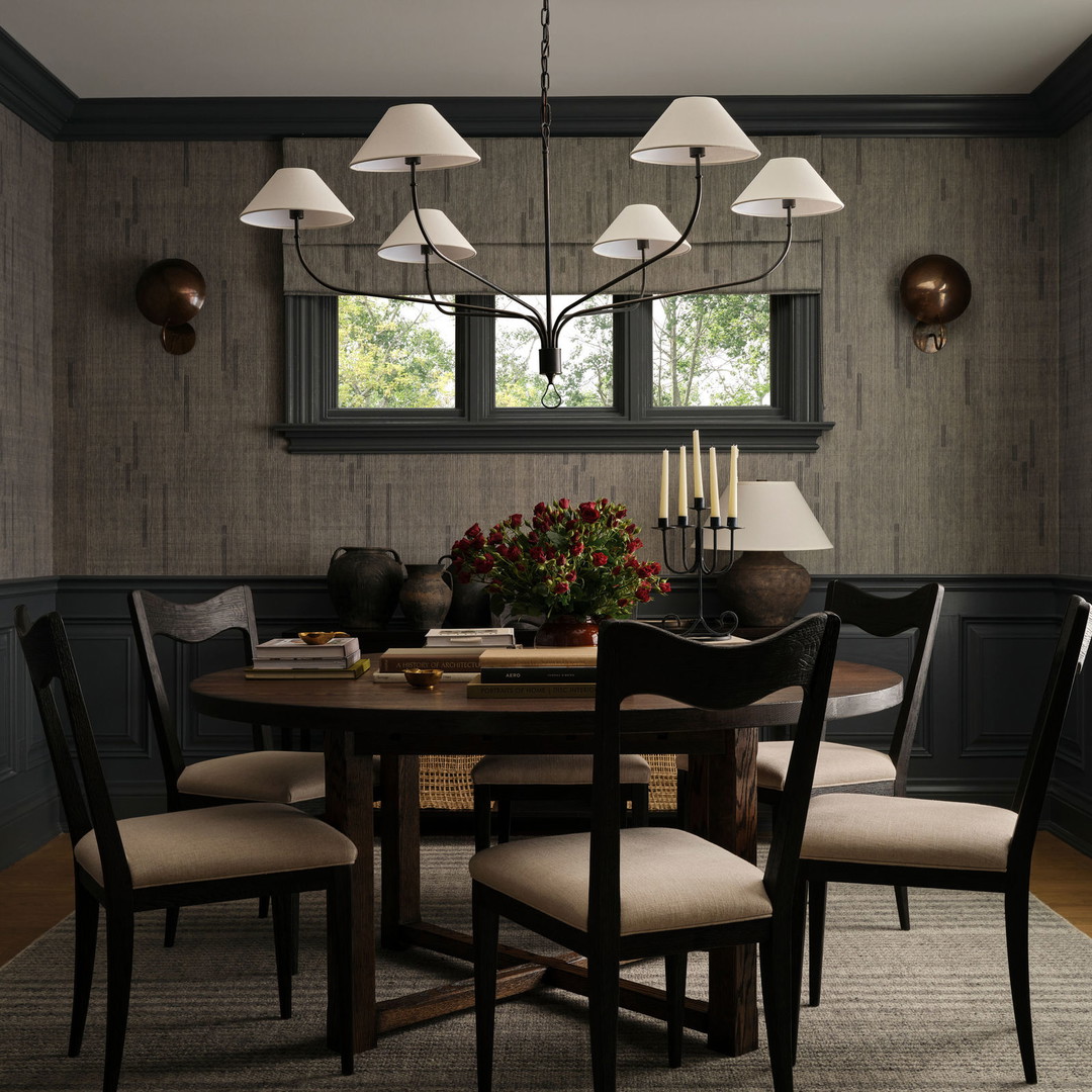 a dining room with a table and chairs