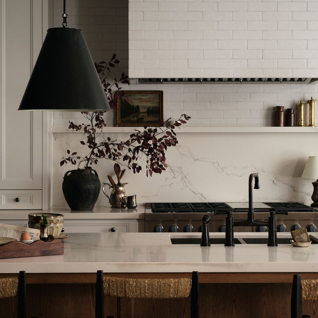 a kitchen with a stove top oven sitting next to a counter