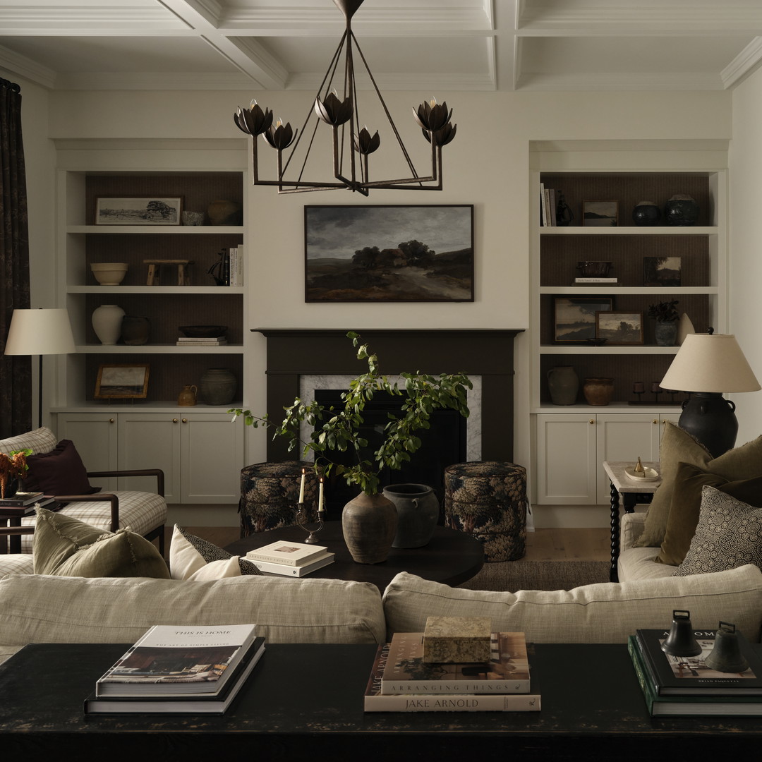 a living room filled with furniture and a fire place