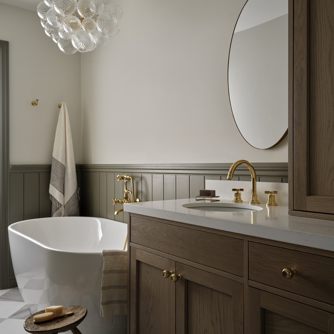 a bath room with a bath tub a sink and a mirror