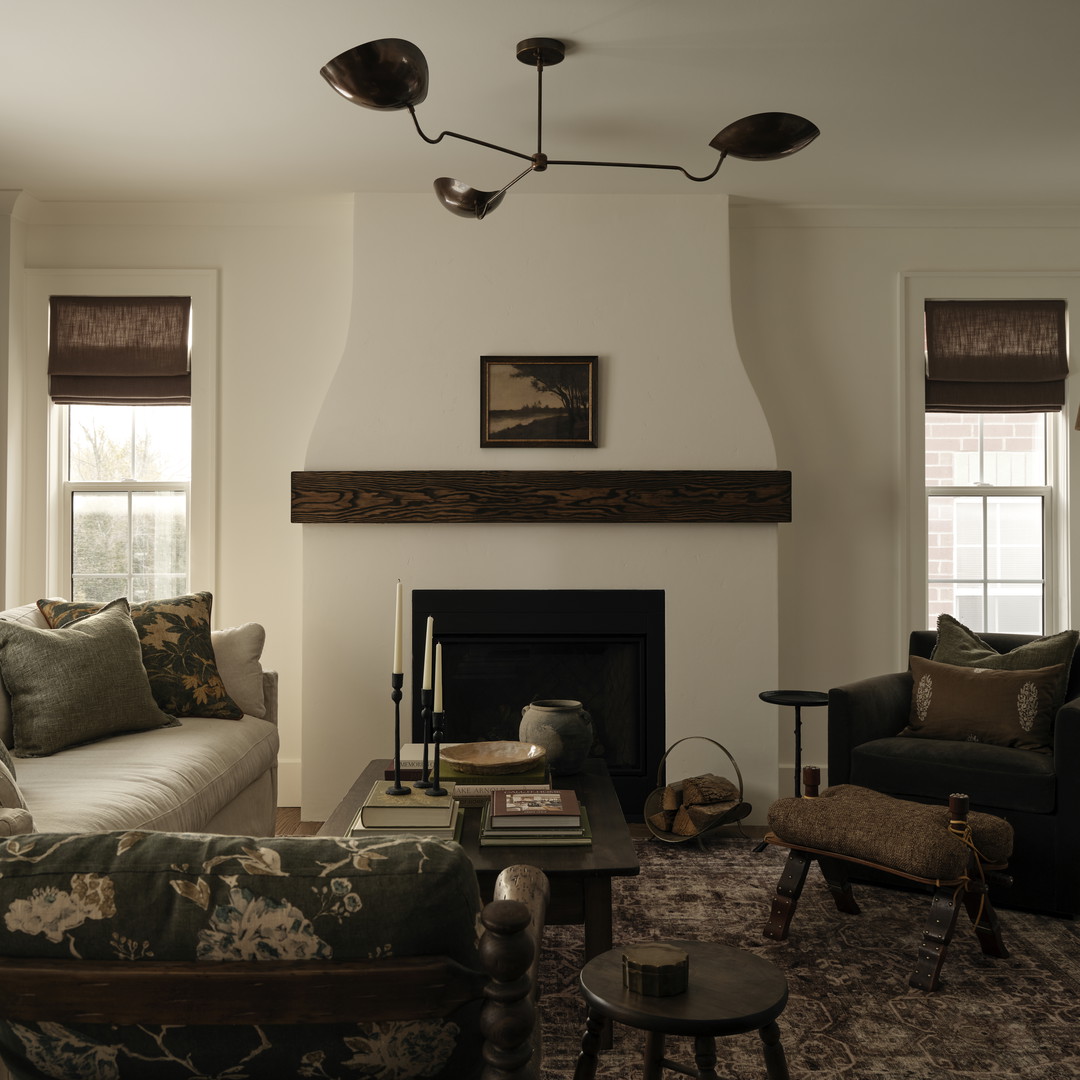 a living room filled with furniture and a fire place