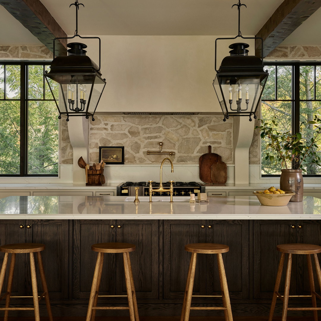 a kitchen with a center island with stools