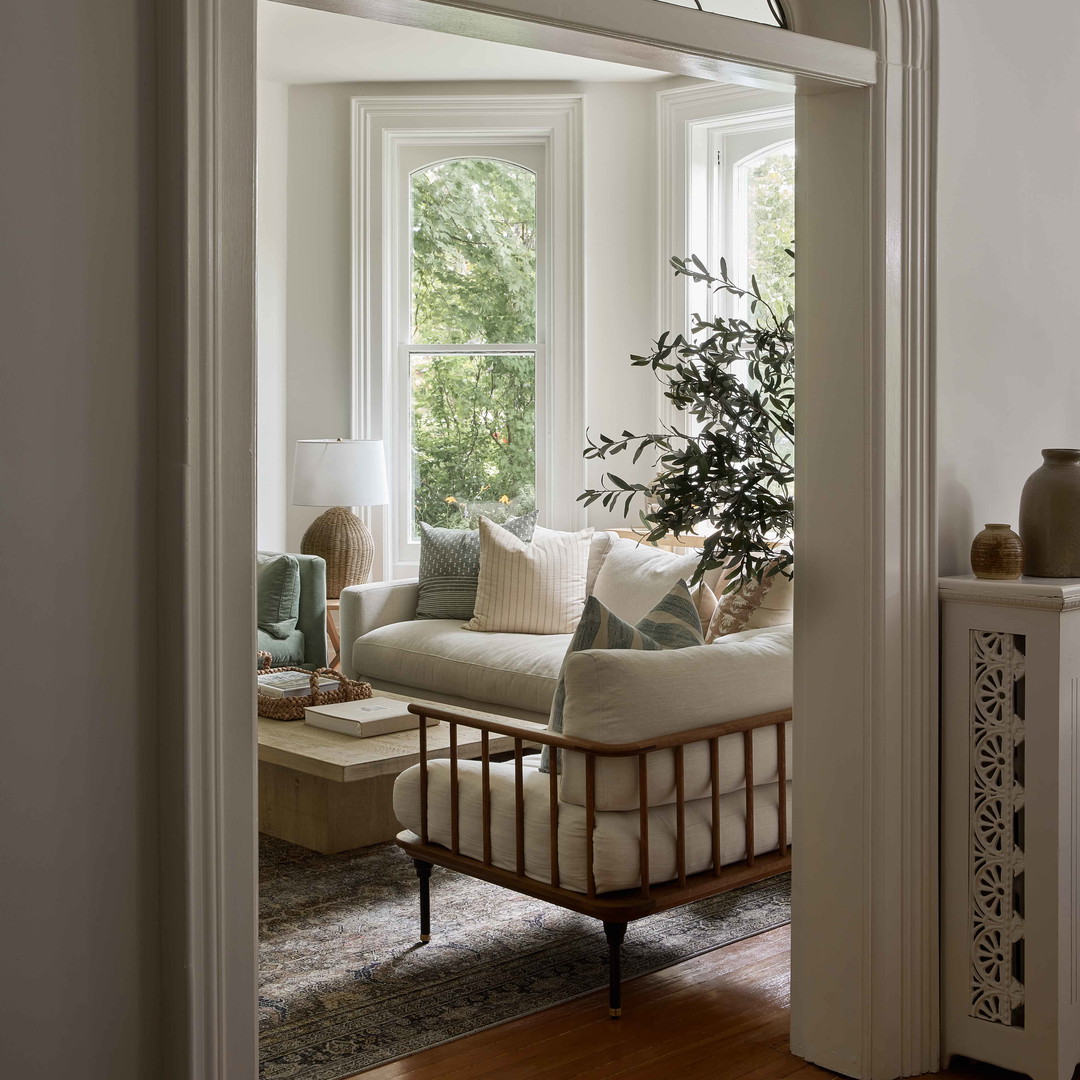 a living room filled with furniture and a window