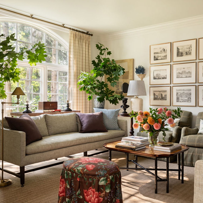 a living room filled with furniture and a large window