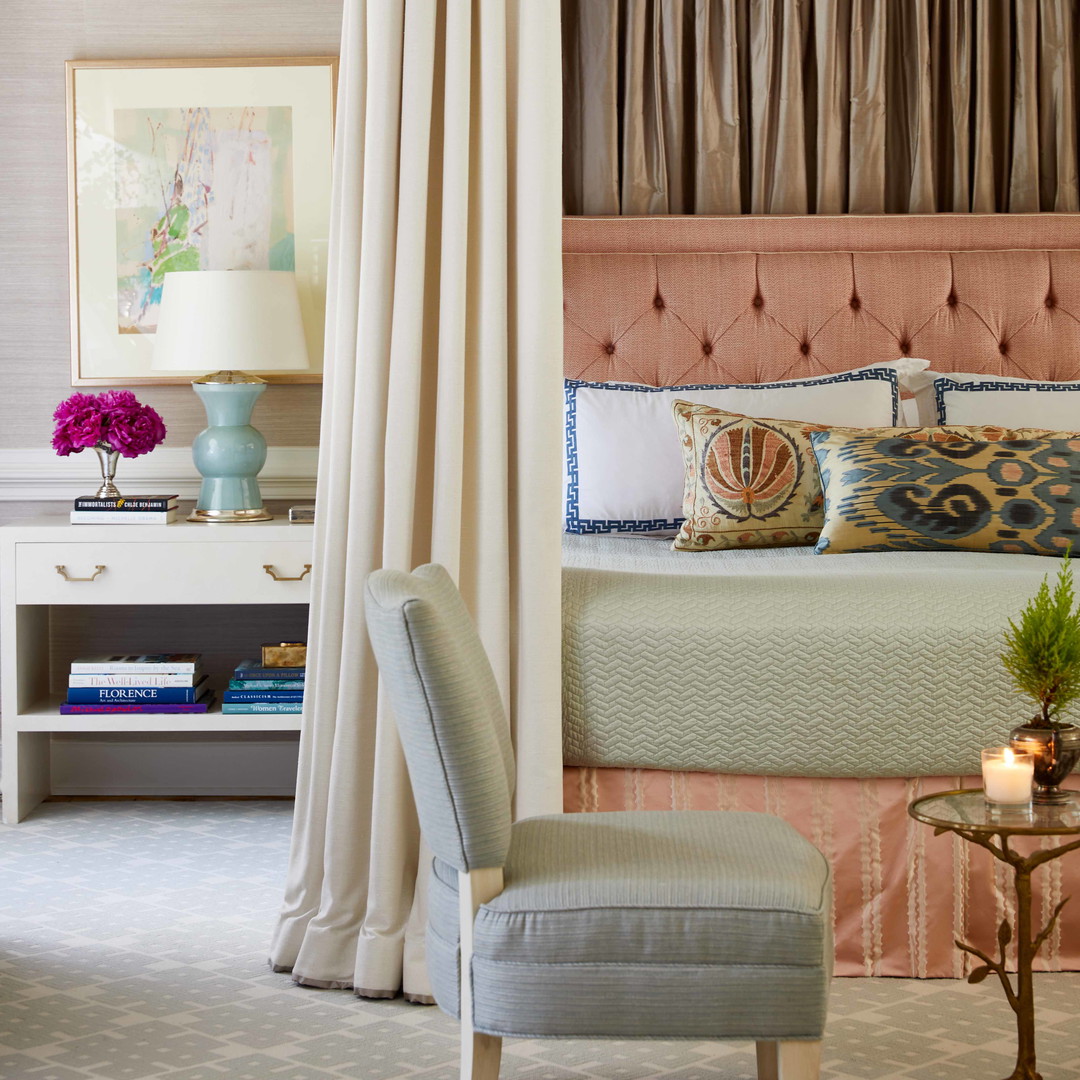 a bedroom with a bed and a chair