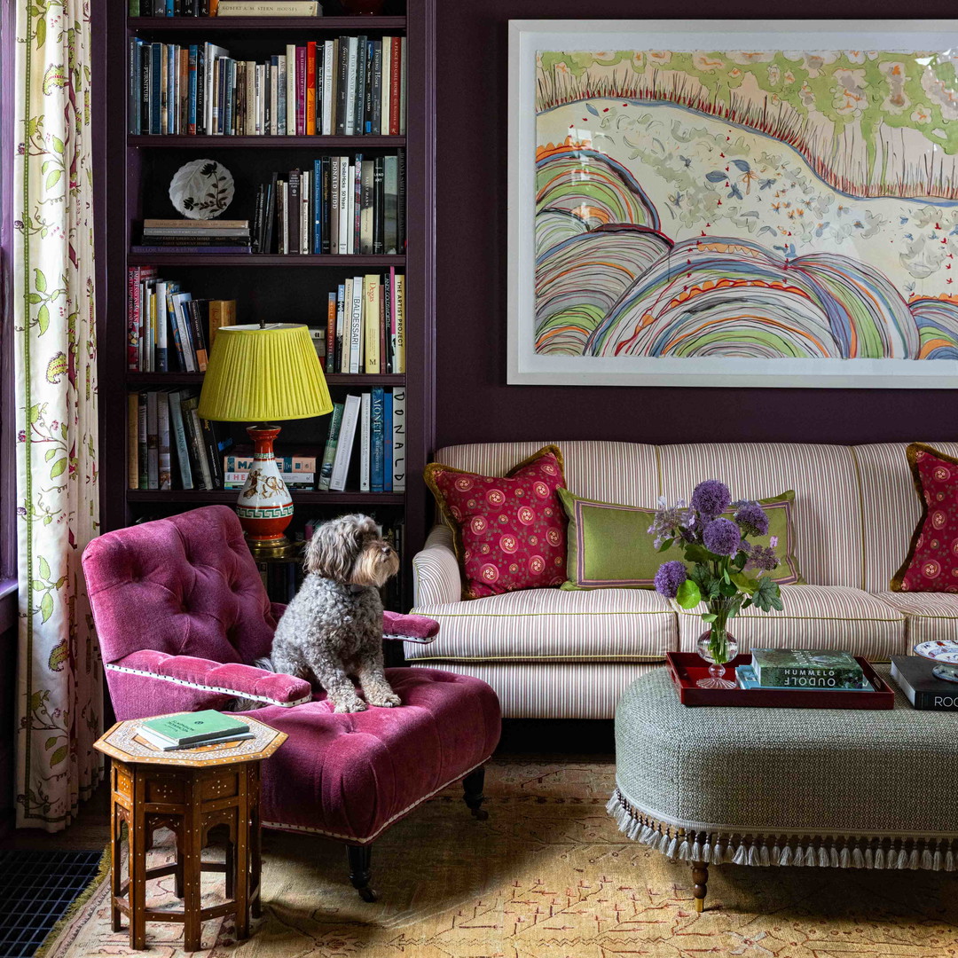 a dog sitting on a chair in a living room