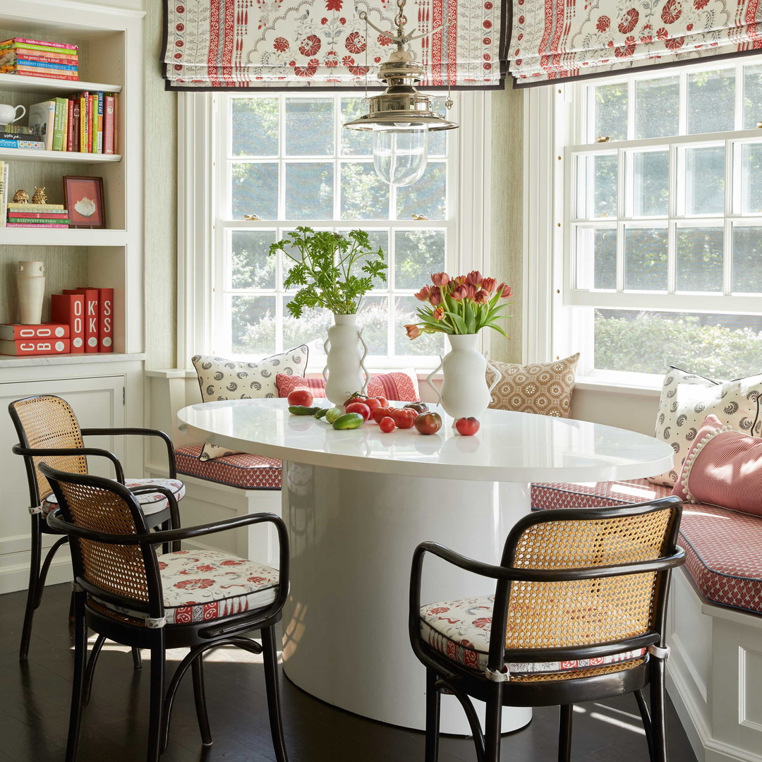 a dining room with a table and chairs