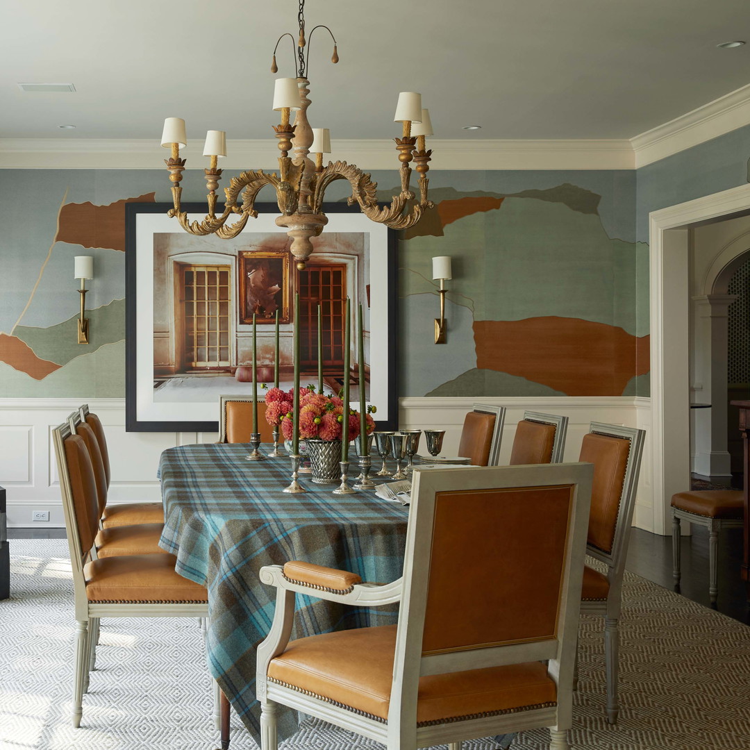 a dining room with a table and chairs