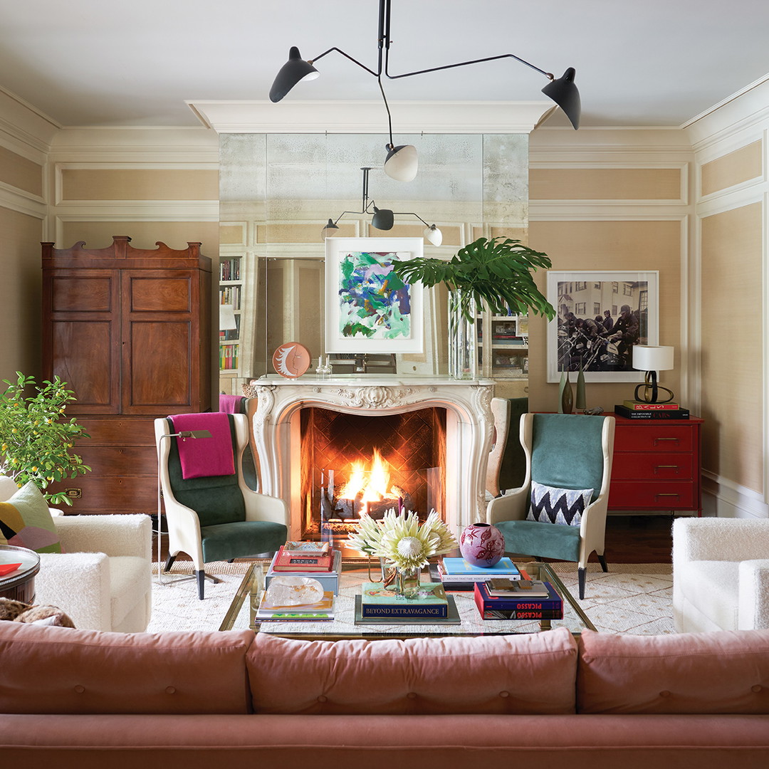 a living room filled with furniture and a fire place