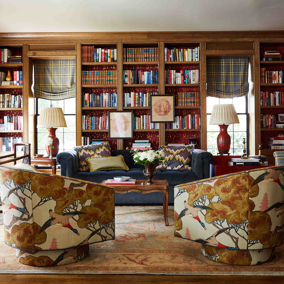 a living room filled with furniture and a fire place