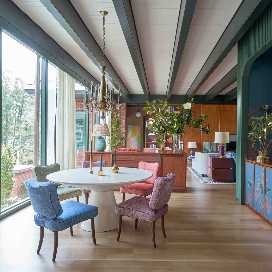 a dining room with a table and chairs