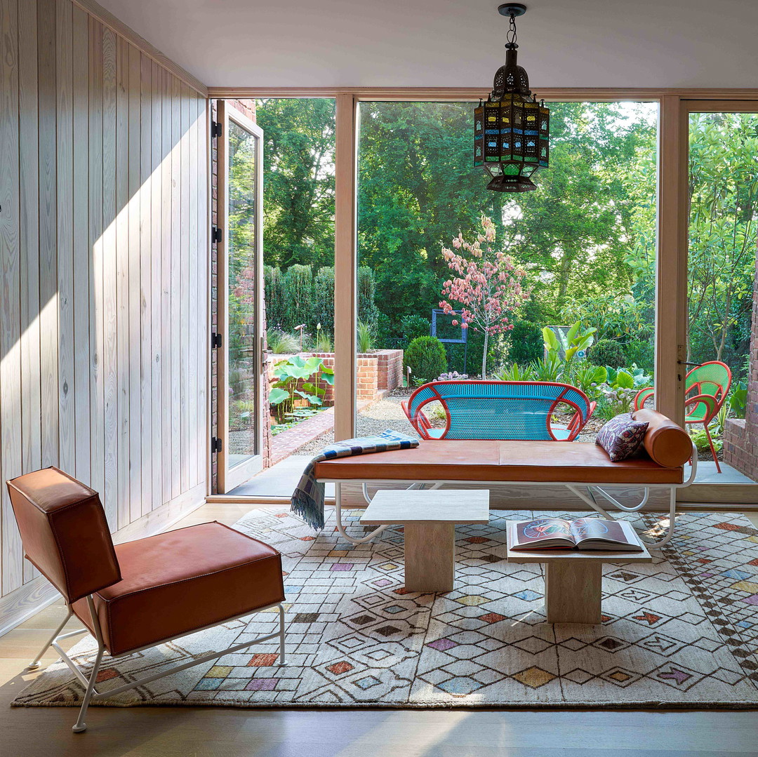 a room with a table, chairs, and a couch