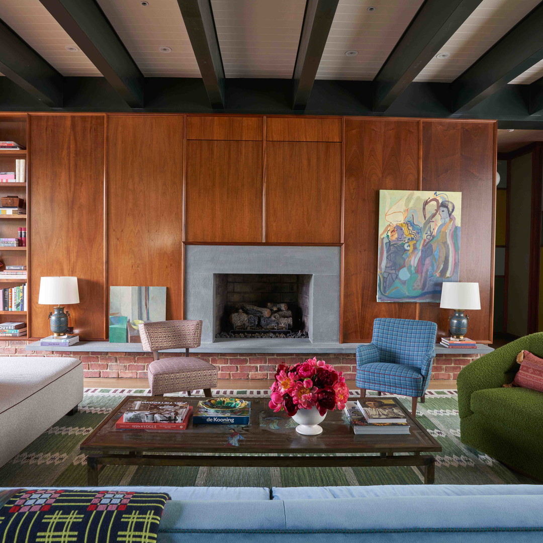 a living room filled with furniture and a fire place
