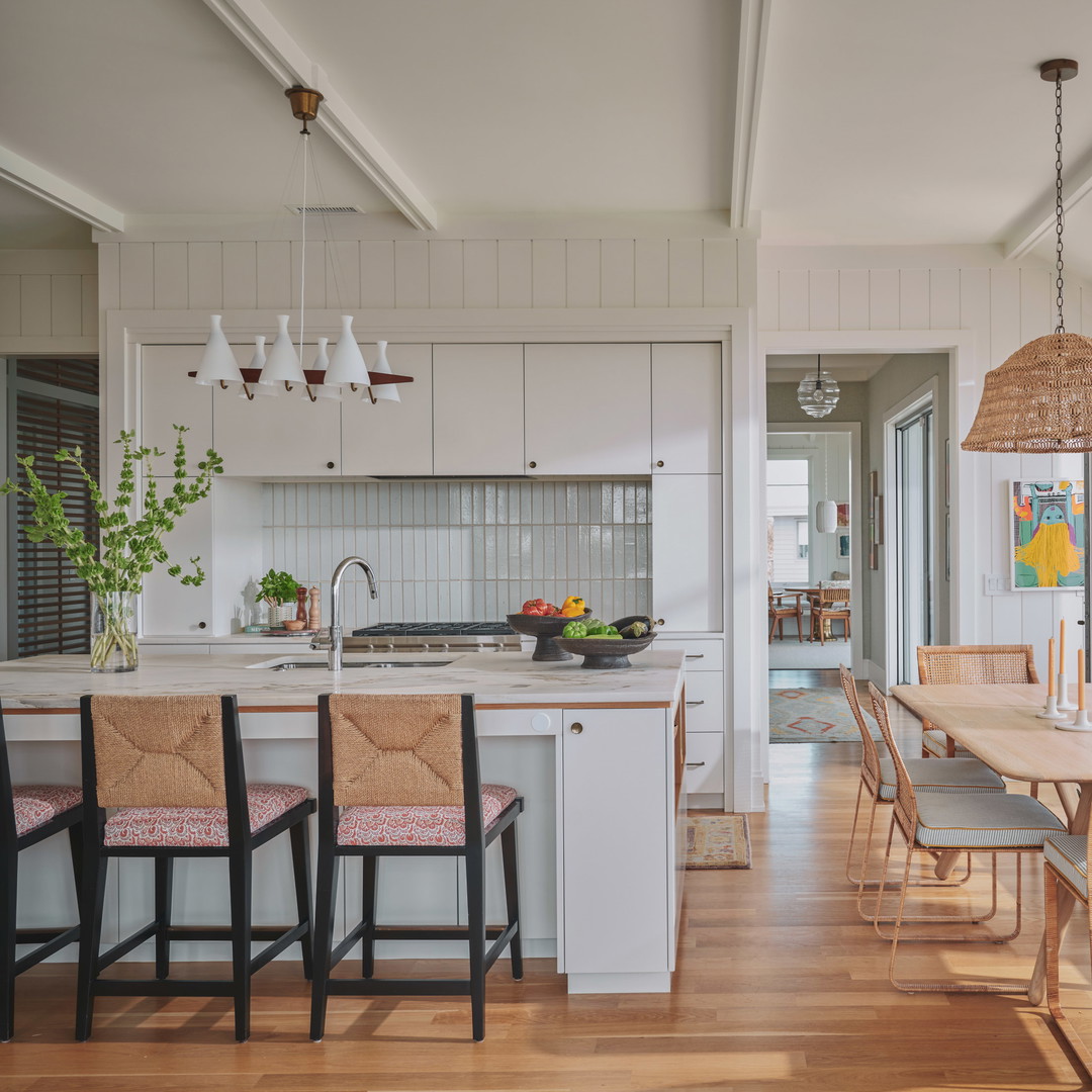 a kitchen with a dining table and chairs