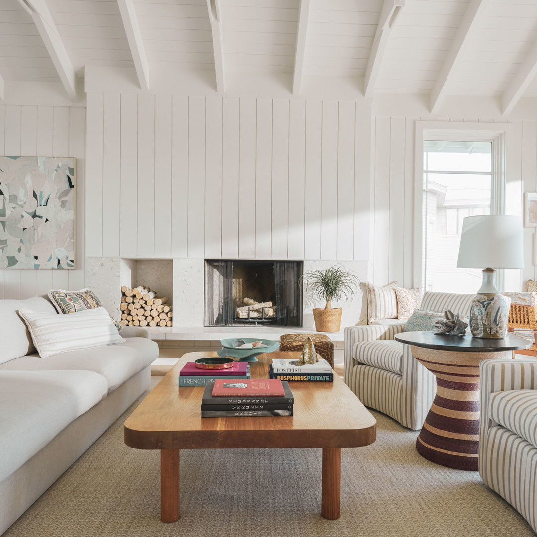 a living room filled with furniture and a fire place