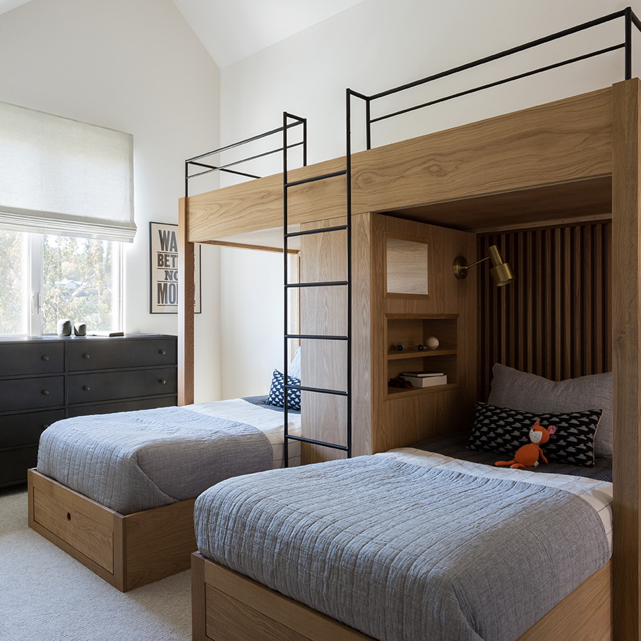 a couple of beds sitting next to each other in a bedroom