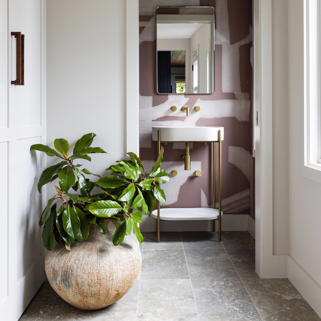 a bathroom with a plant in the middle of the floor