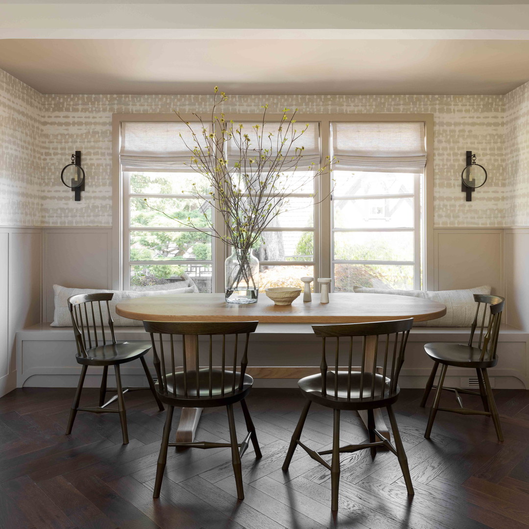 a dining room with a table and chairs