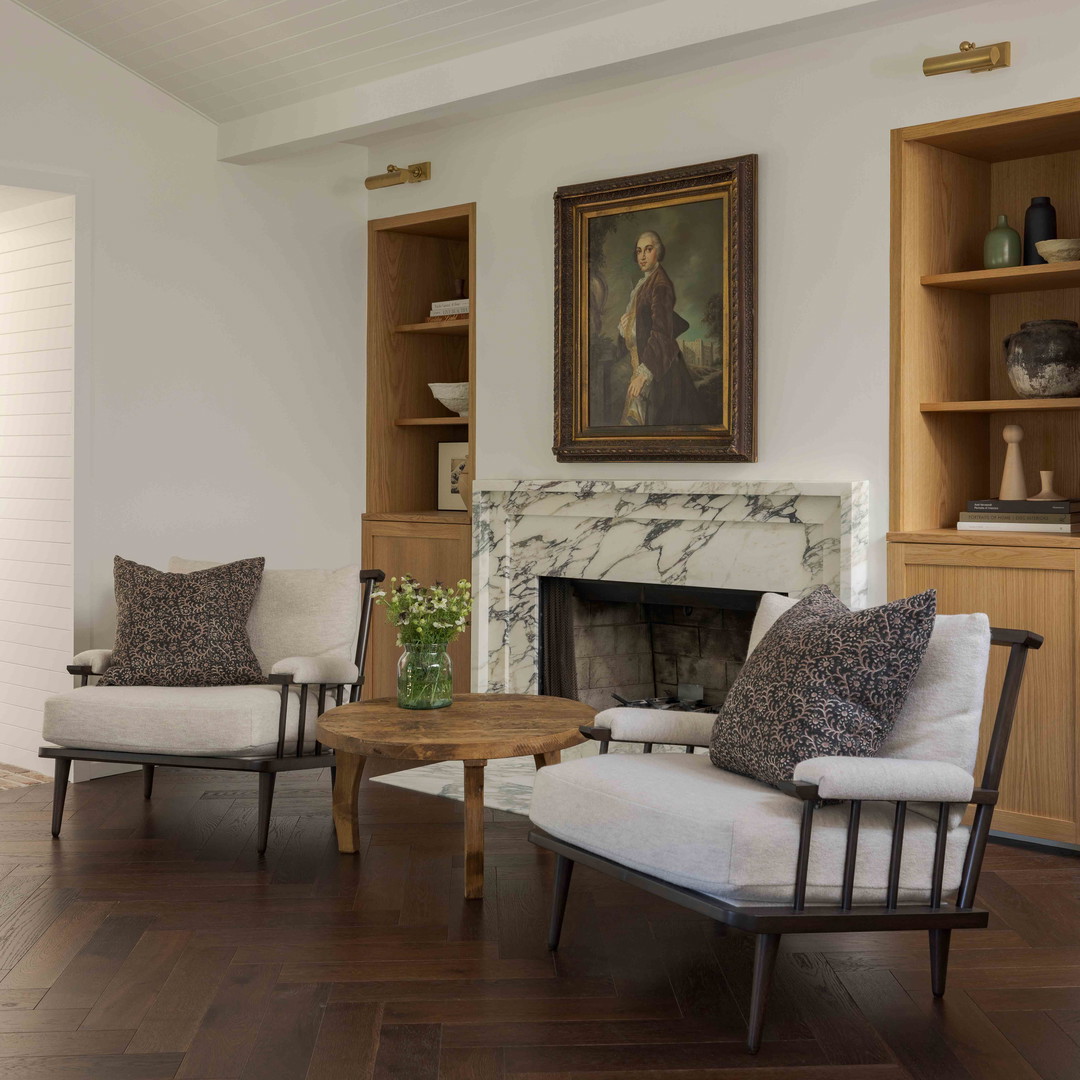 a living room filled with furniture and a fire place