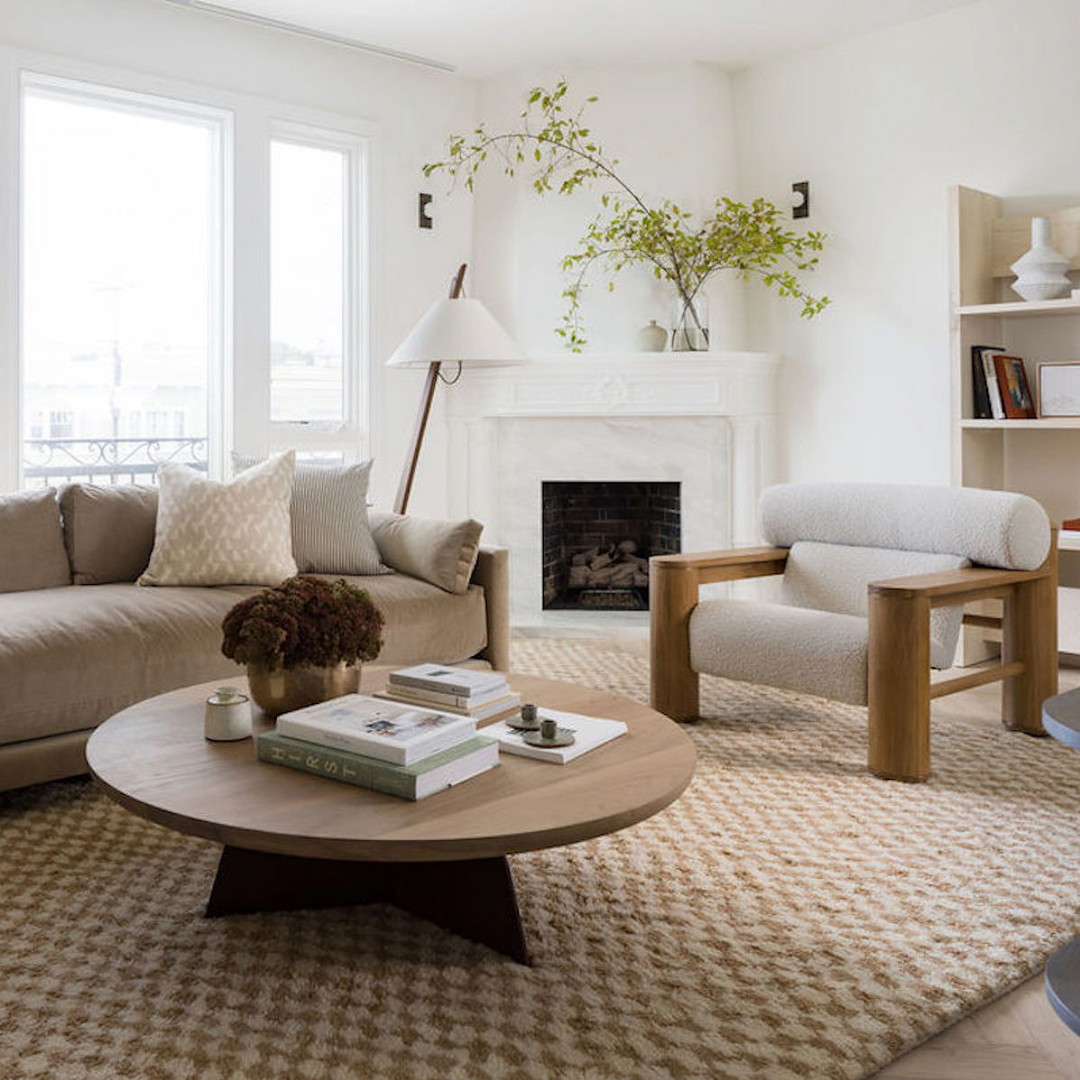 a living room filled with furniture and a fire place