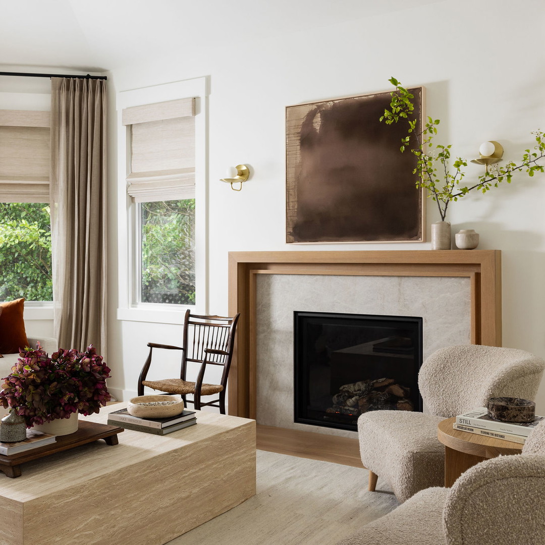 a living room filled with furniture and a fire place