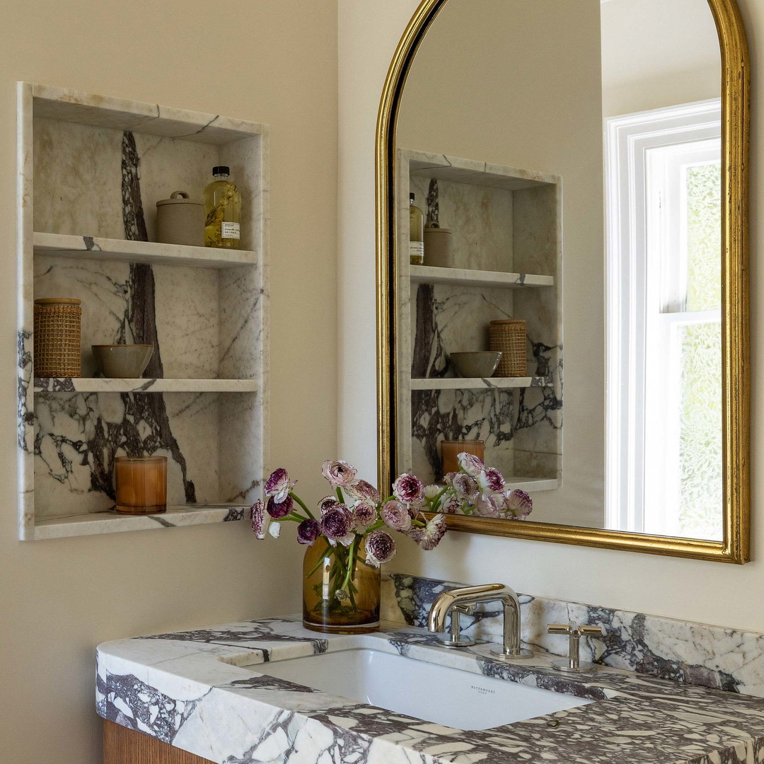 a bathroom sink with a mirror above it