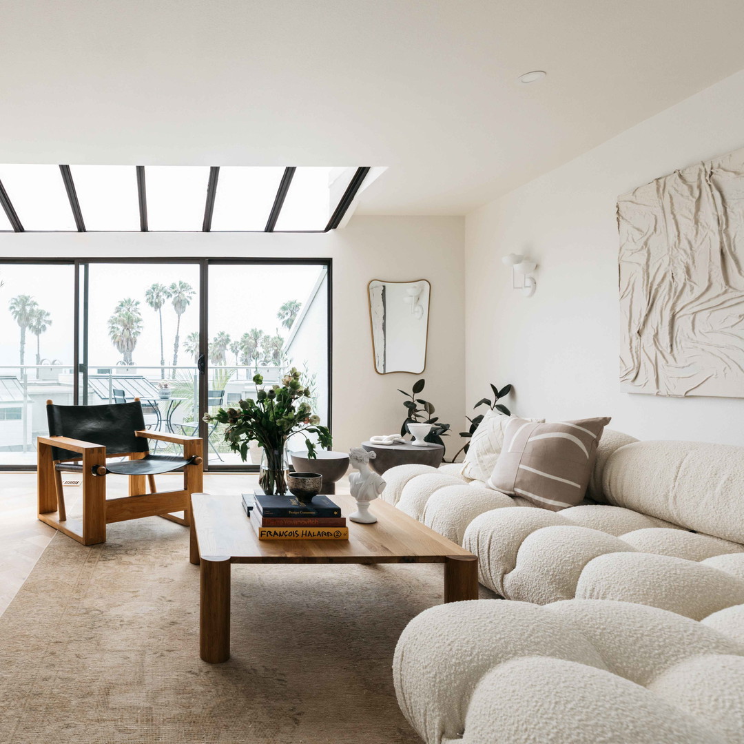 a living room filled with furniture and a fire place