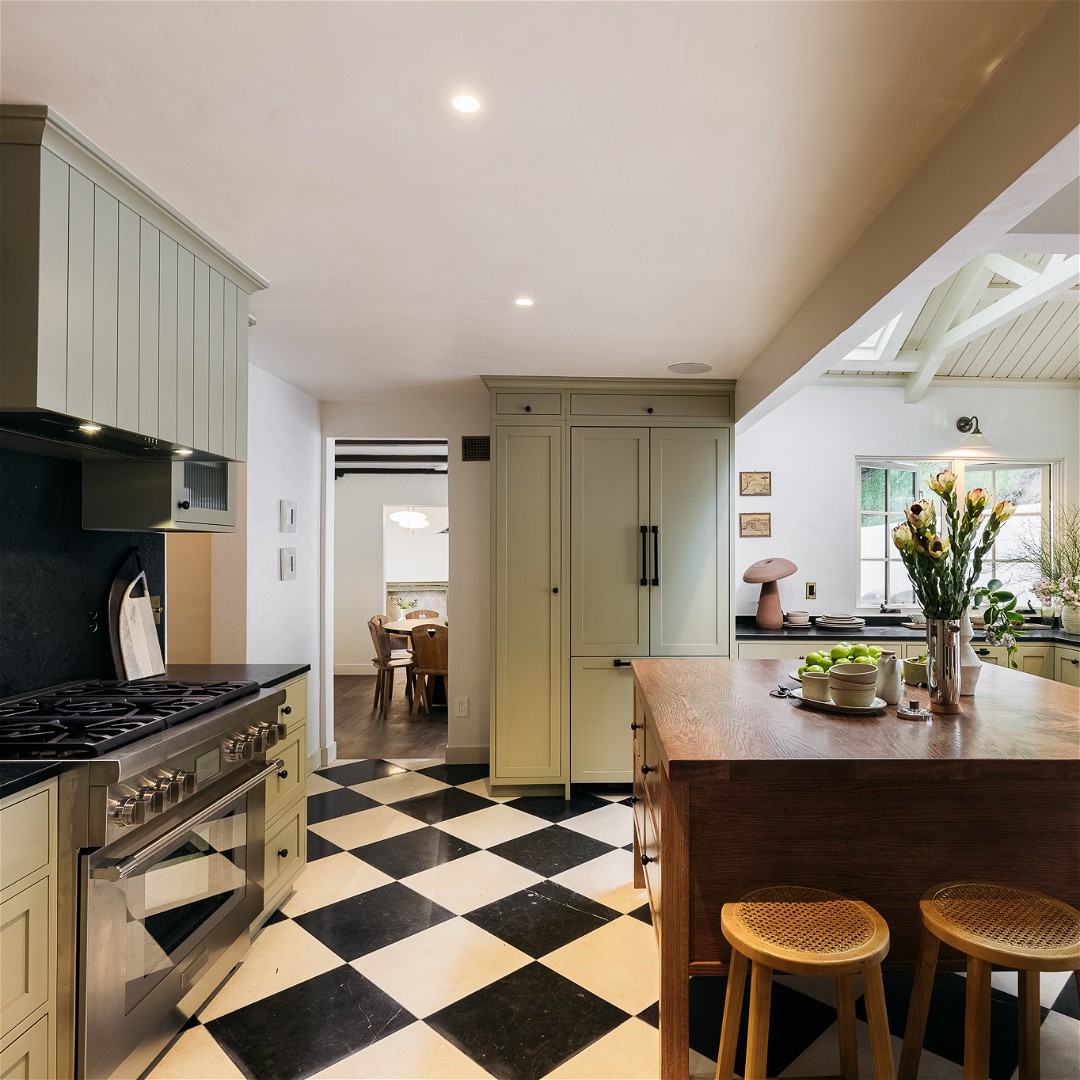 a black and white checkered floor in a kitchen