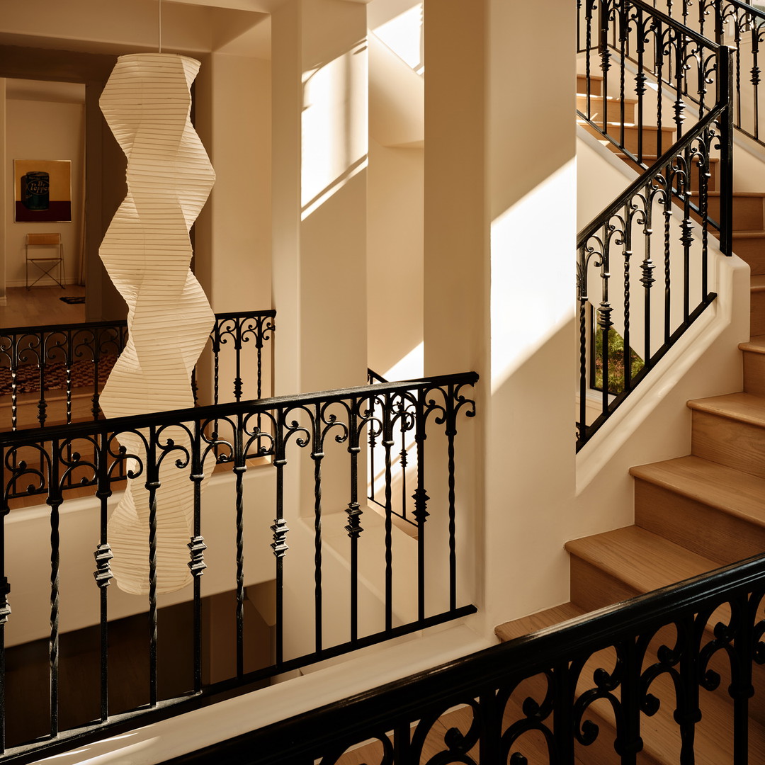 a staircase in a house with a large window