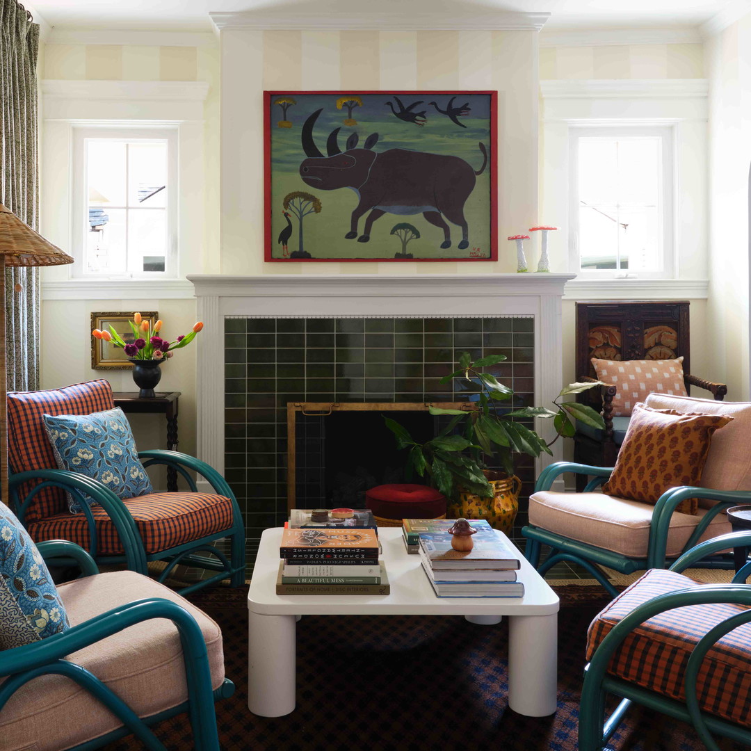 a living room filled with furniture and a fire place