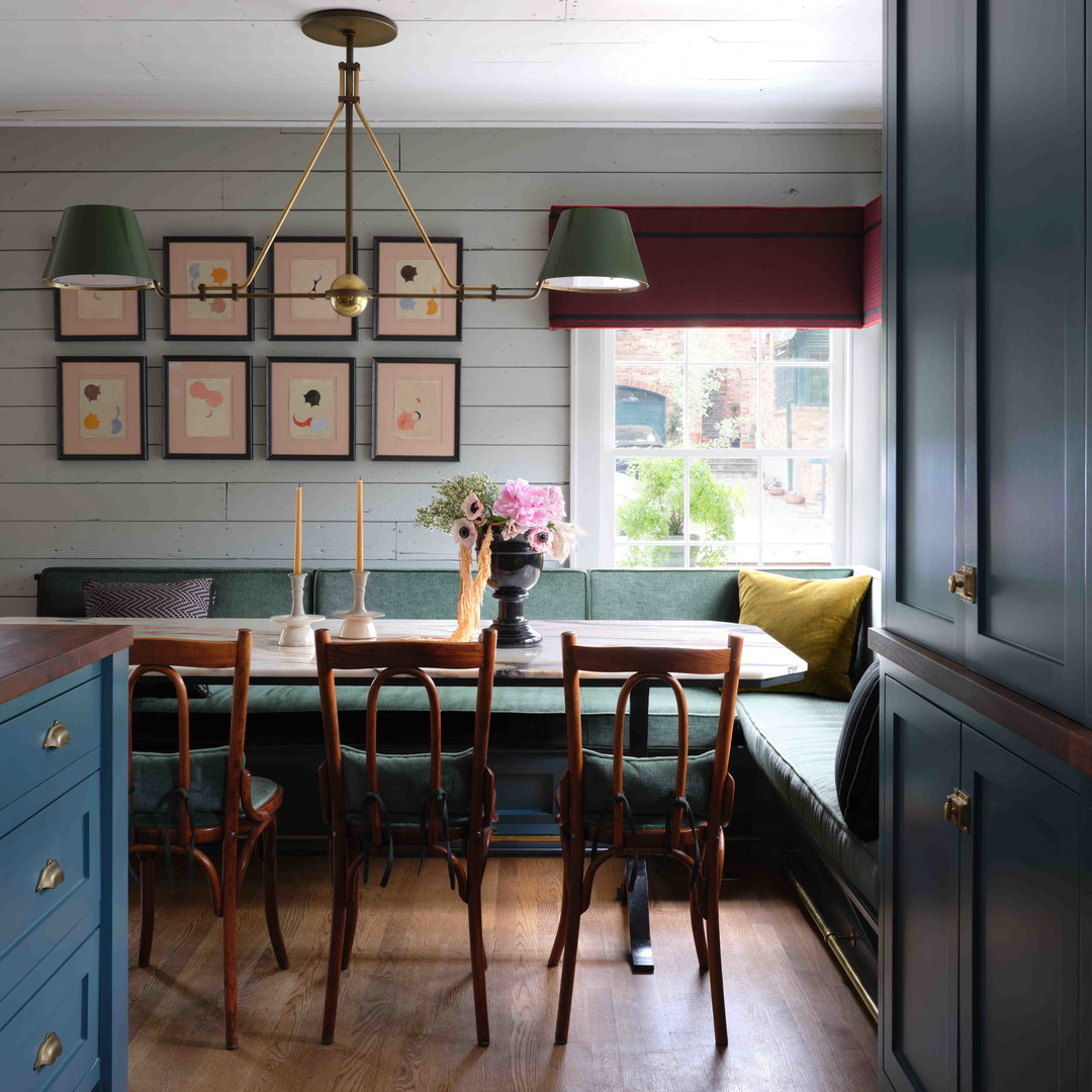 a dining room with a table and chairs