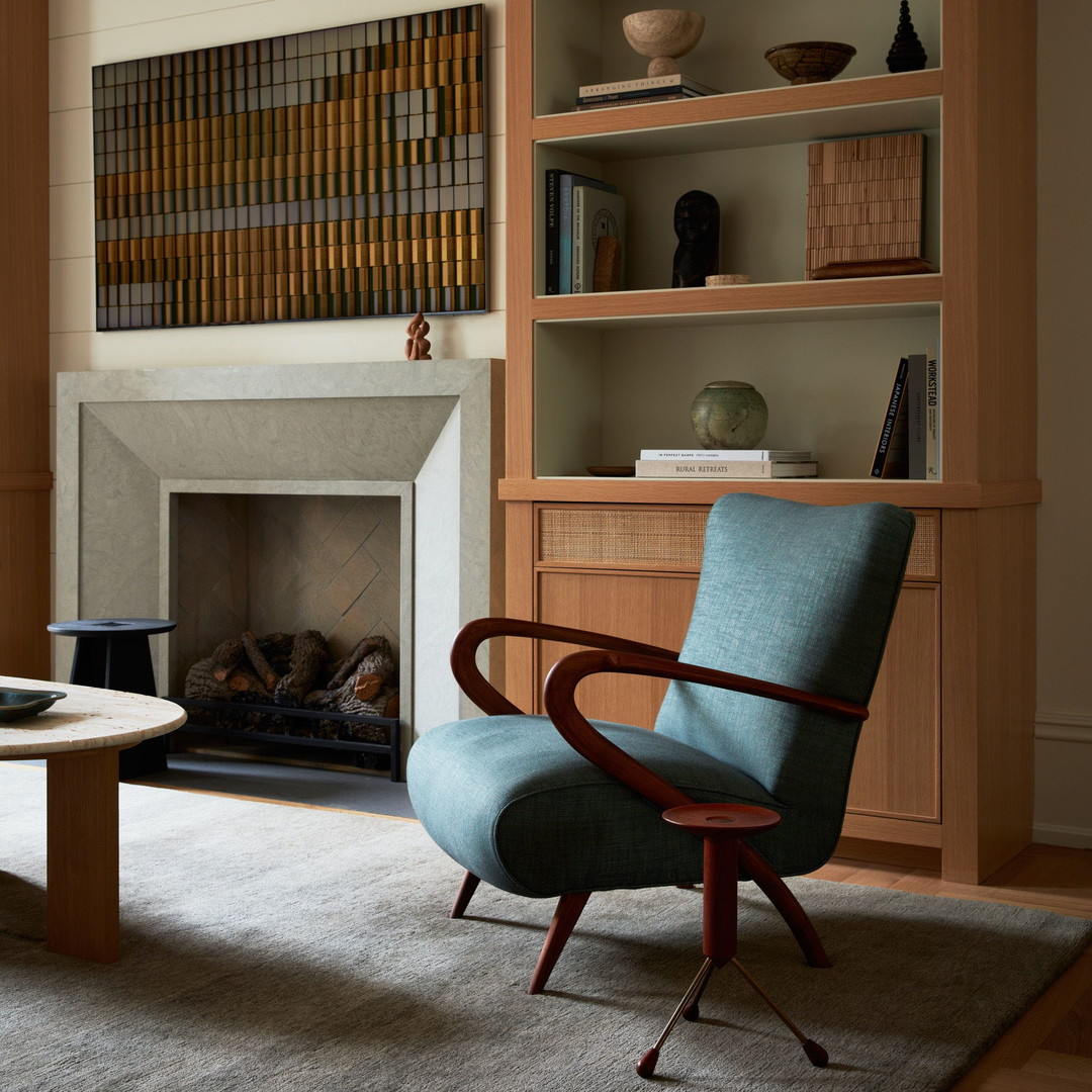 a living room filled with furniture and a fire place