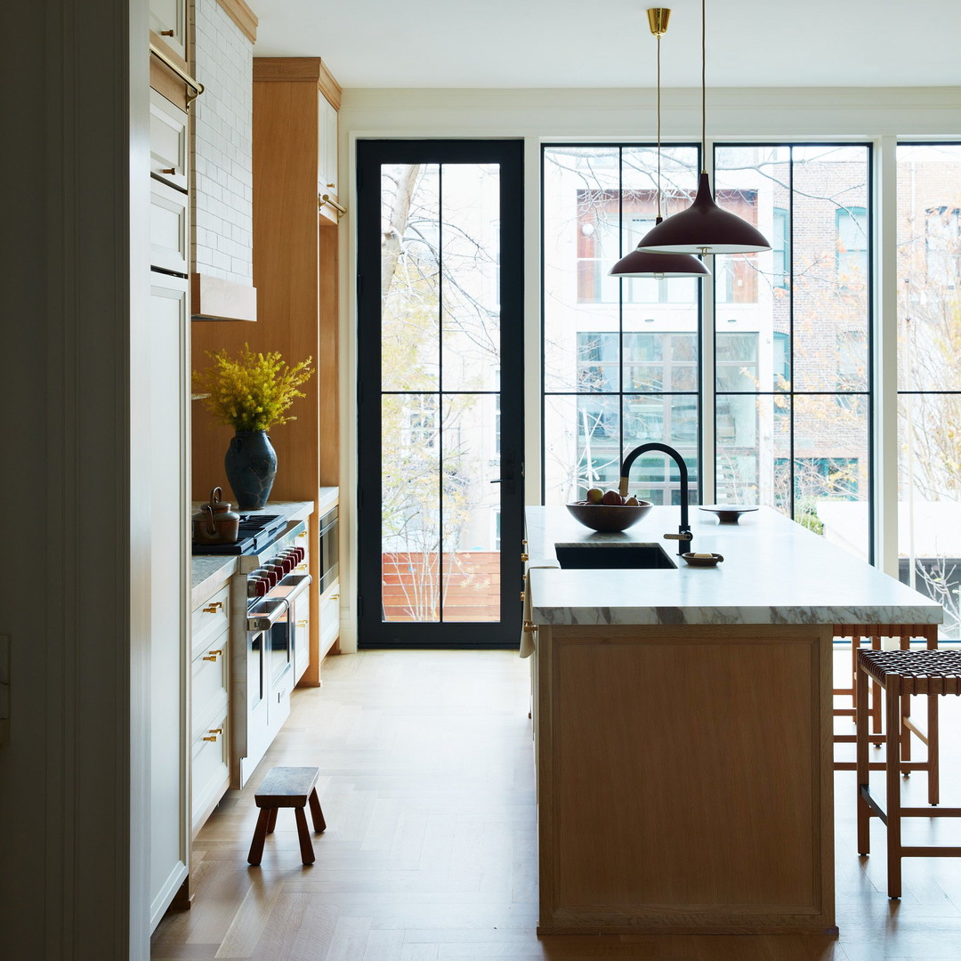 a kitchen with a center island and a table