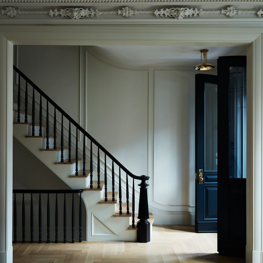 a room with a staircase and a door