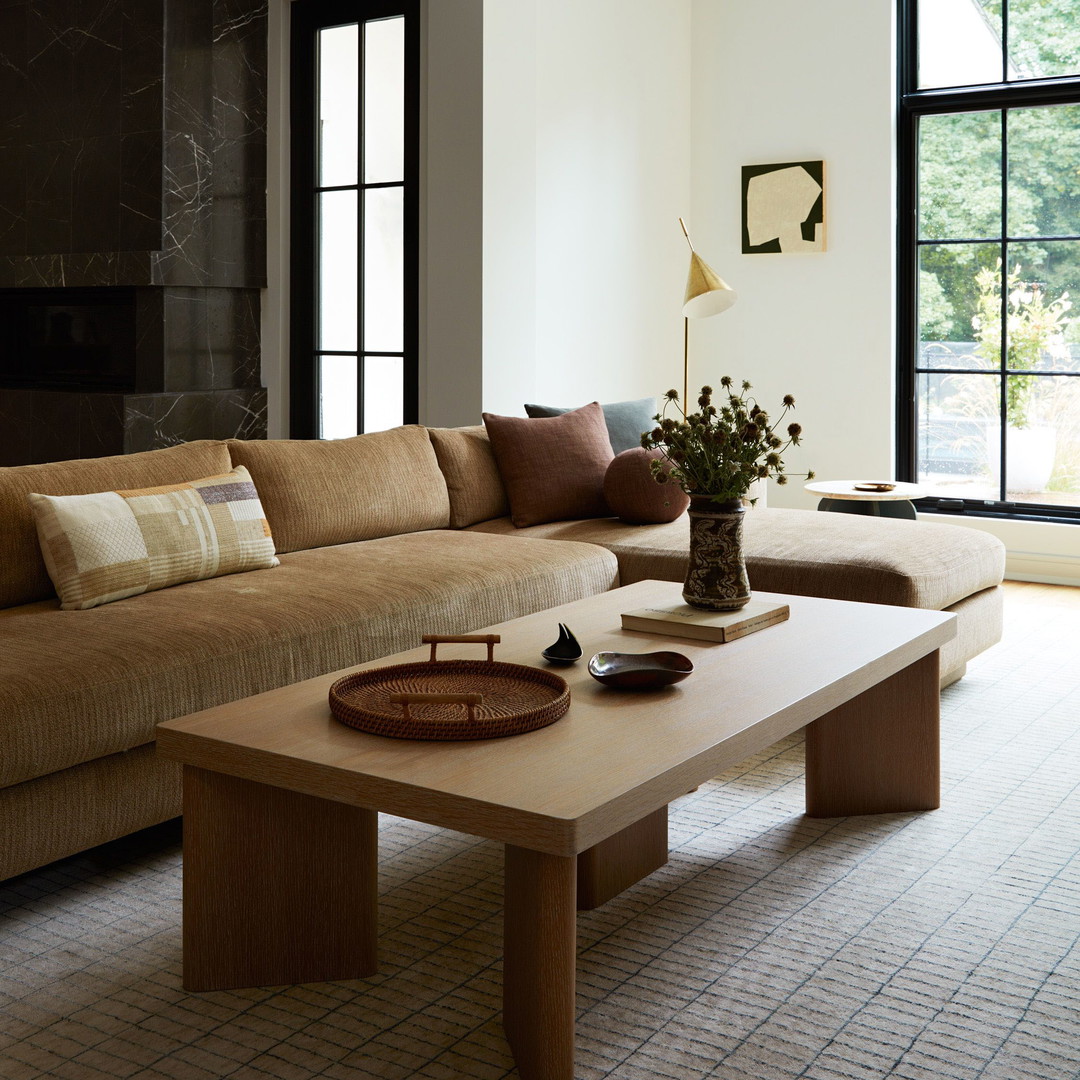 a living room filled with furniture and a large window