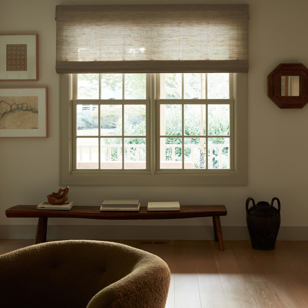 a living room filled with furniture and a window