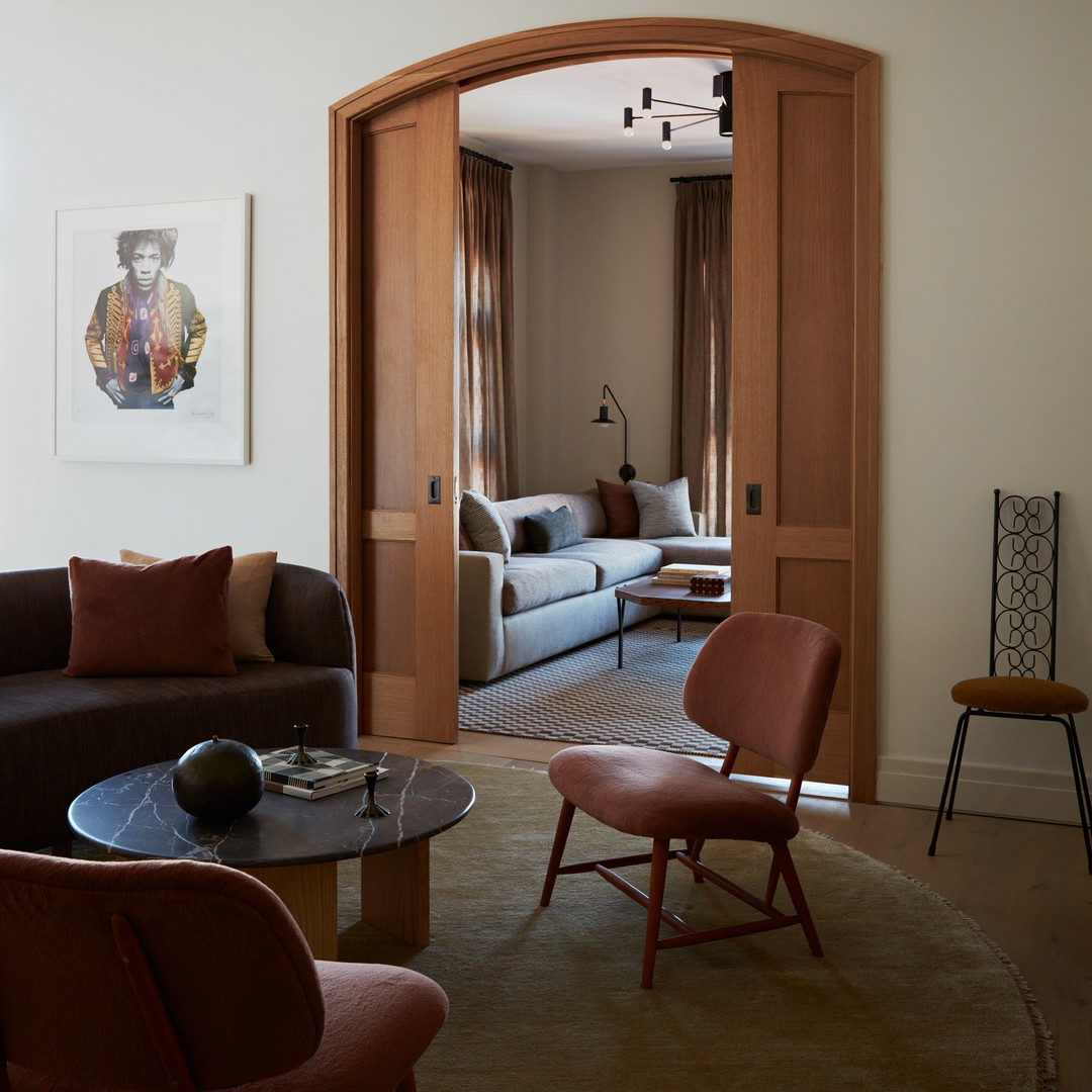 a living room filled with furniture and a doorway