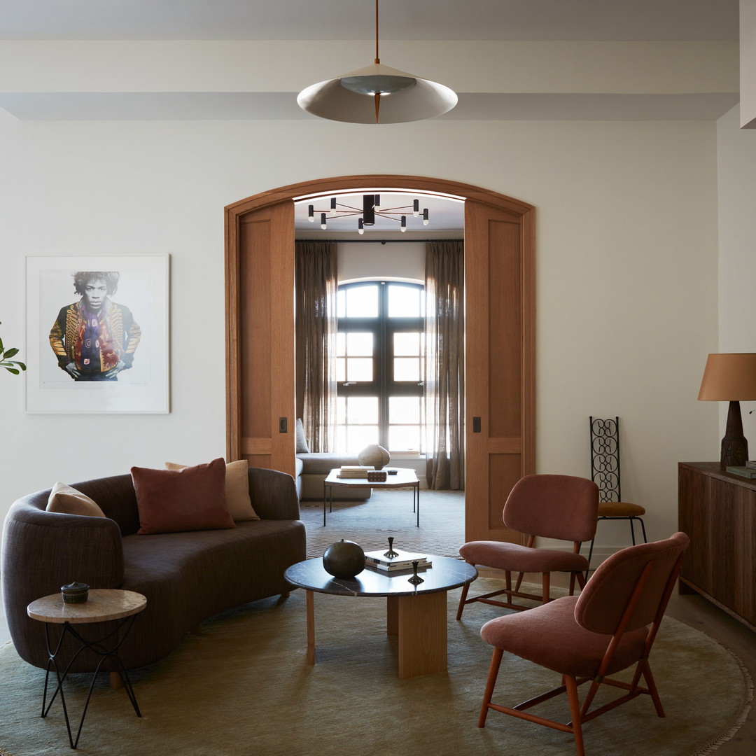 a living room filled with furniture and a doorway