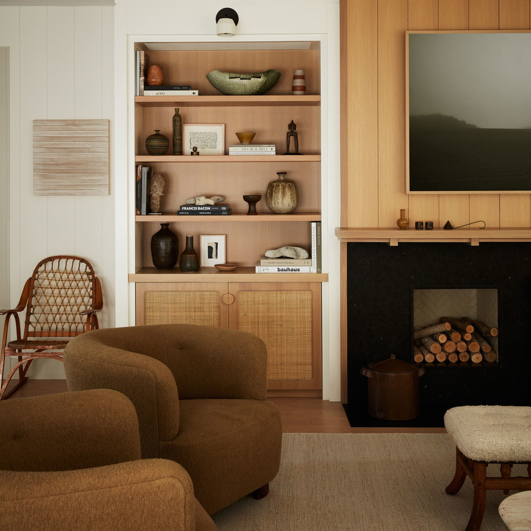 a living room filled with furniture and a fire place