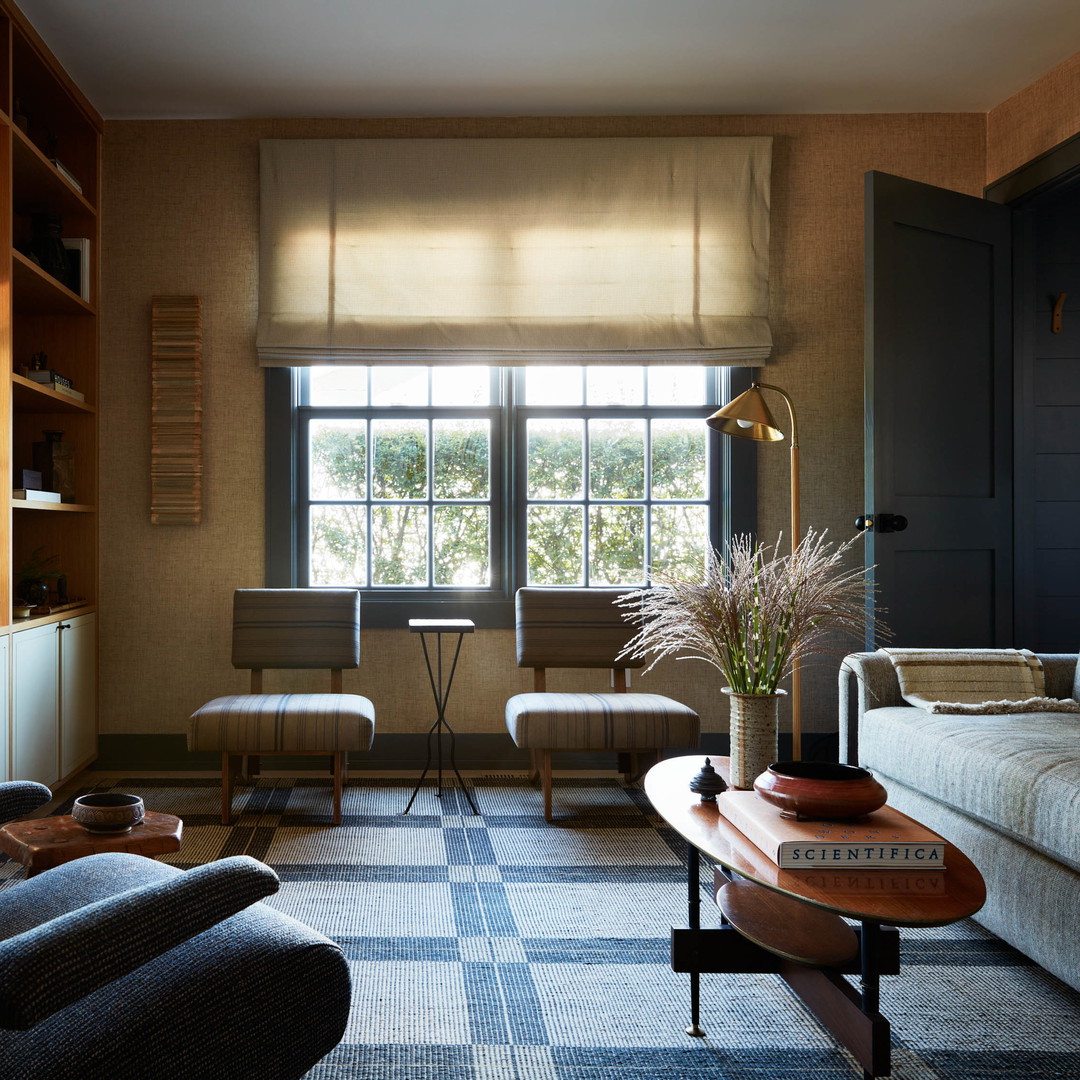 a living room filled with furniture and a window