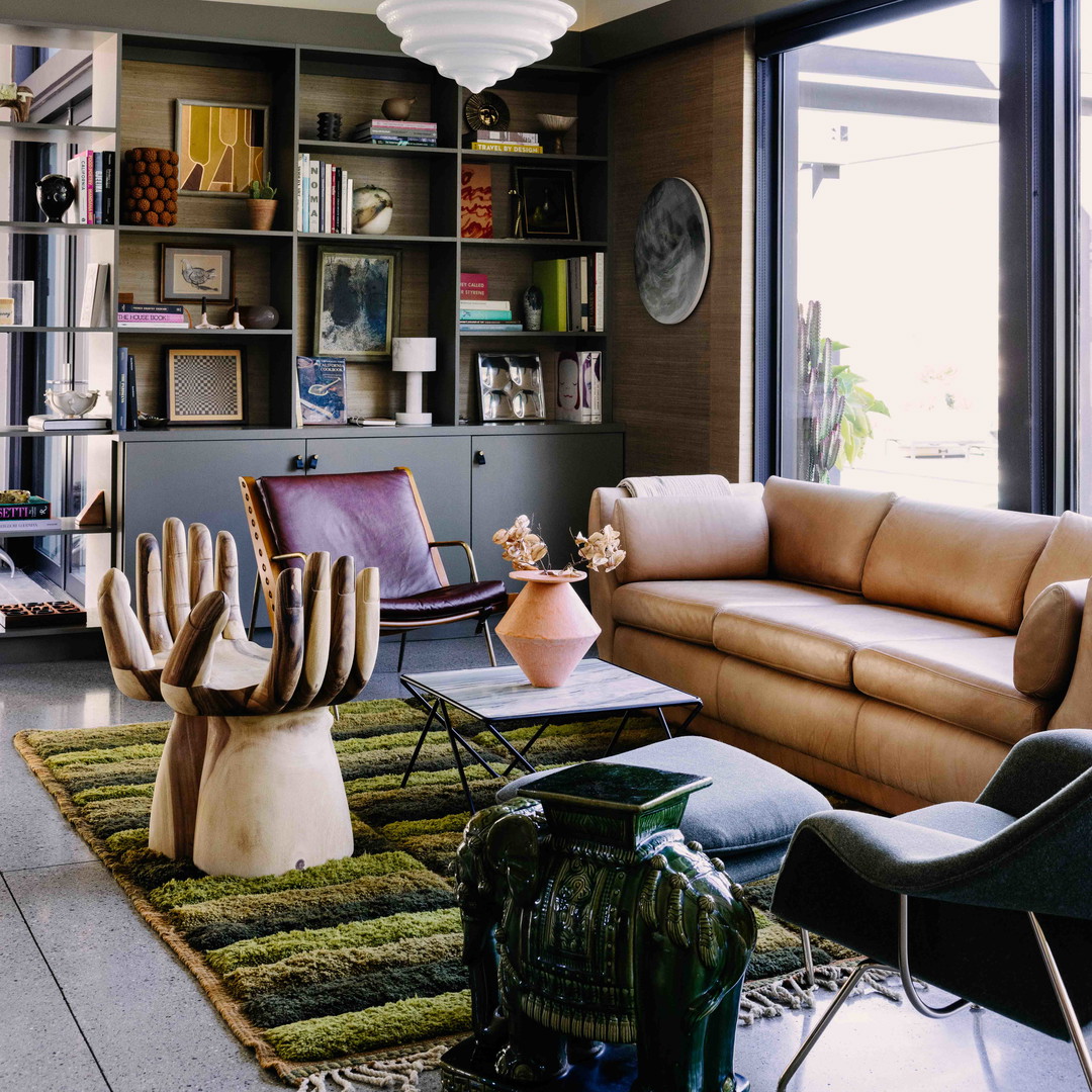 a living room filled with furniture and a large window