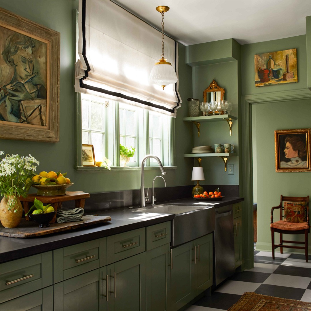 a kitchen with green cabinets and a checkered floor