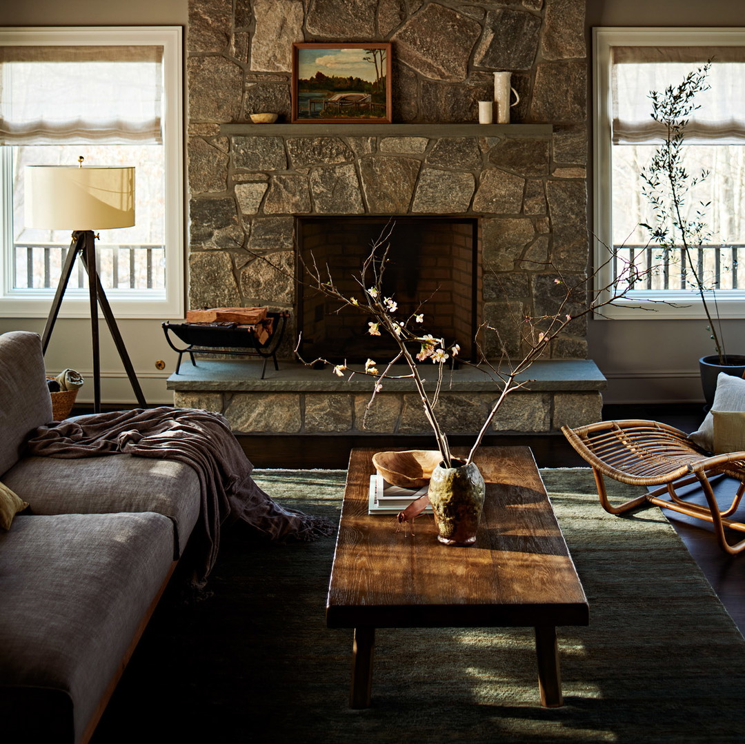 a living room filled with furniture and a fire place