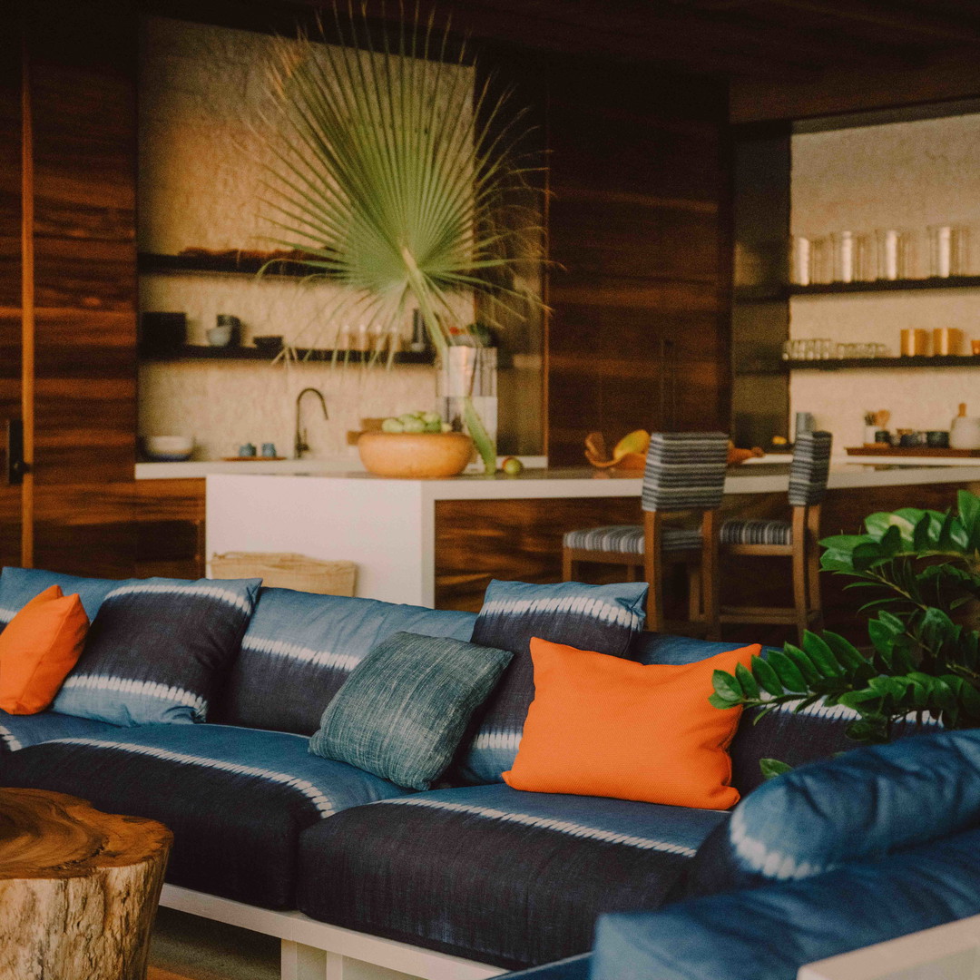 a living room filled with furniture and a wooden table