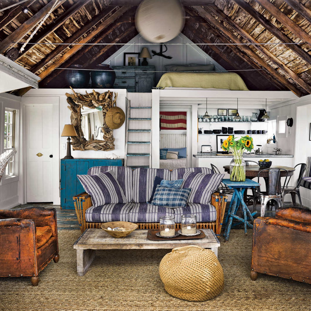 a living room filled with furniture and a wooden ceiling