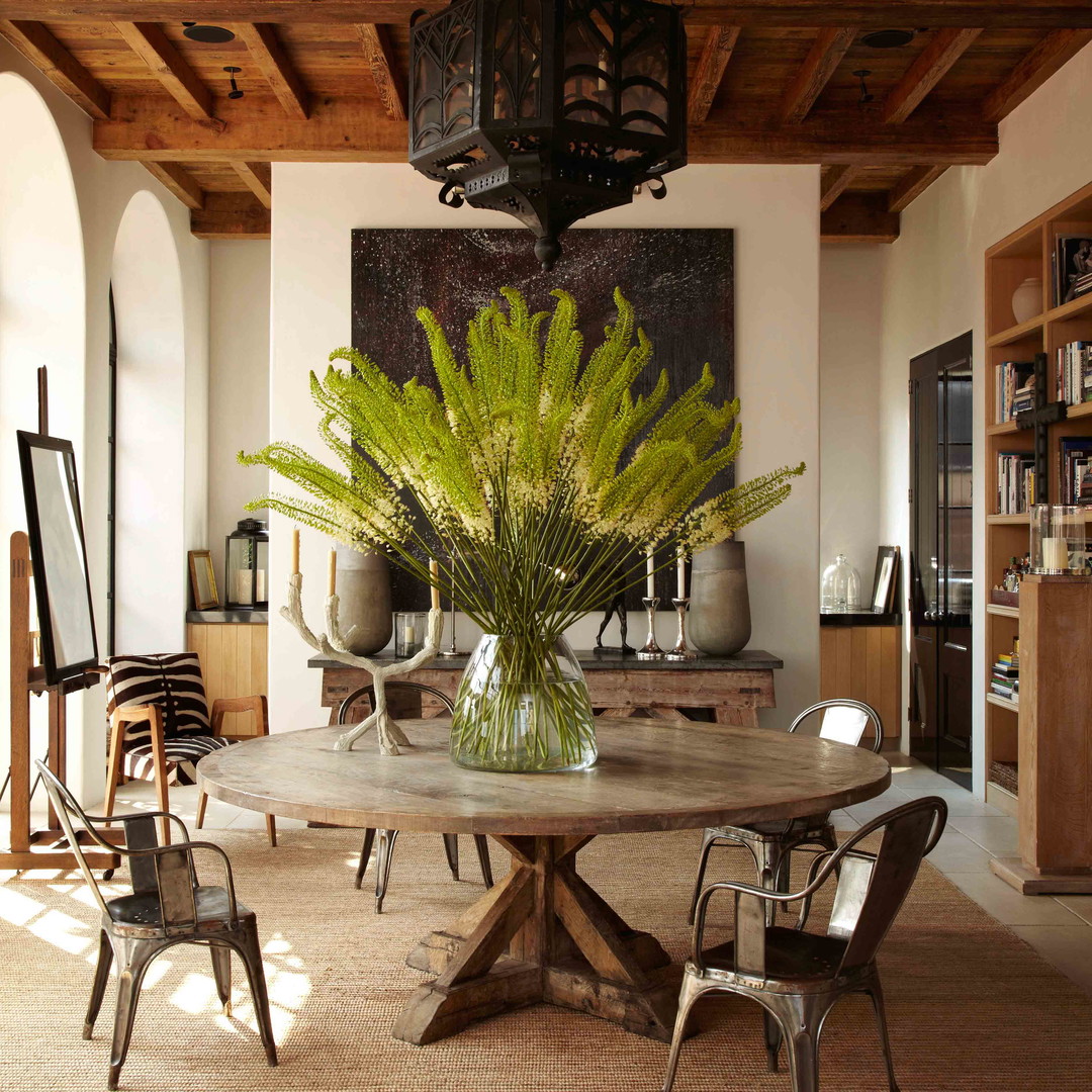 a dining room with a table and chairs